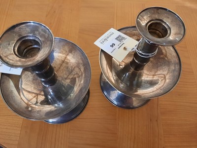 Lot 66 - A pair of silver candlesticks