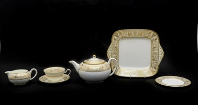 Lot 119 - A Wedgwood porcelain ‘Gold Florentine’ pattern tea service for twelve
