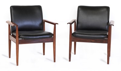Lot 341 - A pair of 'Model 209' rosewood Diplomat chairs