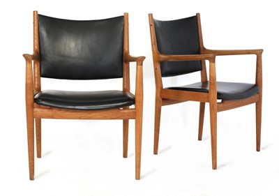 Lot 379 - A pair of 'JH713' oak lounge chairs