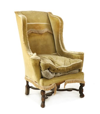 Lot 465 - A William & Mary style wingback armchair