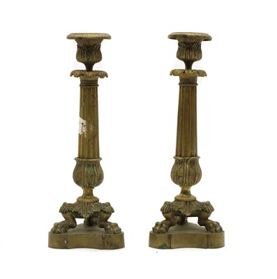 Lot 241 - A pair of Empire bronze candlesticks