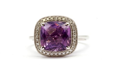 Lot 184 - An 18ct white gold amethyst and diamond ring