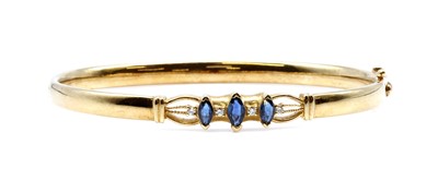 Lot 351 - A sapphire and diamond hinged bangle, by Colombian Emeralds International