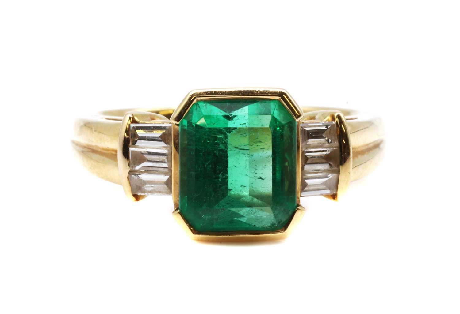 Lot 471 - A single stone emerald ring with diamond set shoulders, by Colombian Emeralds International, c.2005