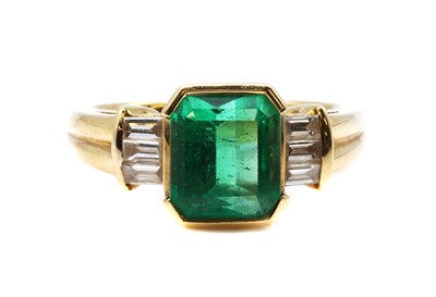 Lot 471 - A single stone emerald ring with diamond set shoulders, by Colombian Emeralds International, c.2005