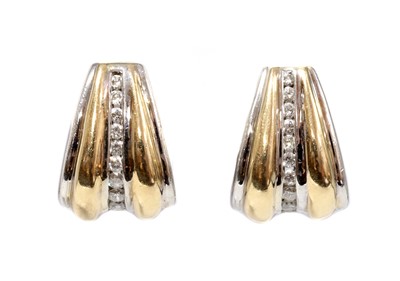Lot 122 - A pair of American two colour gold, diamond set, hinged cuff style earrings
