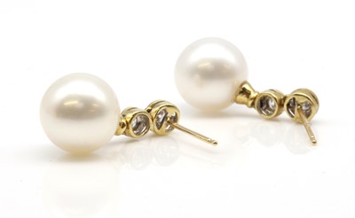 Lot 248 - A pair of cultured South Sea pearl and diamond drop earrings