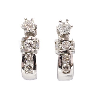 Lot 150 - A pair of American diamond set half hoop or cuff style earrings