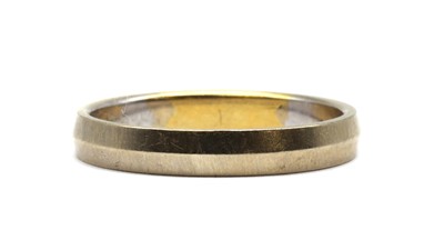 Lot 89 - A two colour gold chevron section wedding ring, by Armin Kurz