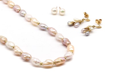 Lot 243 - An opera length uniform cultured freshwater pearl and gold spacer bead necklace