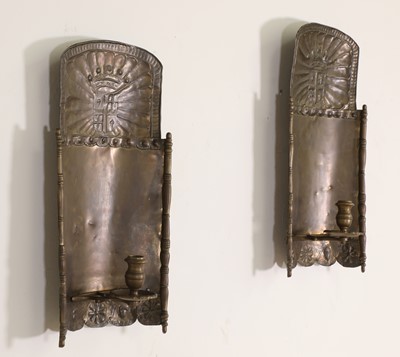 Lot 110 - A pair of pressed brass wall sconces