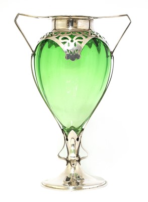 Lot 29 - An Arts and Crafts green glass and silver-mounted vase