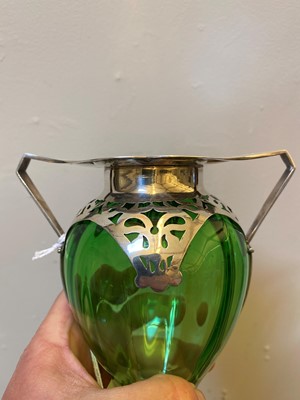 Lot 29 - An Arts and Crafts green glass and silver-mounted vase