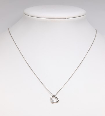 Lot 511 - A platinum open heart pendant, by Elsa Peretti for Tiffany & Co.