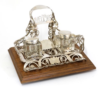 Lot 30 - A silver and oak-mounted desk stand