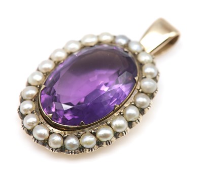 Lot 106 - A late Victorian amethyst and seed pearl pendant
