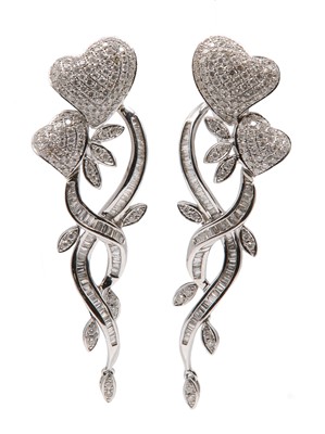 Lot 379 - A pair of diamond set heart drop earrings