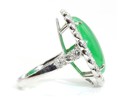 Lot 463 - A dyed jade and diamond oval cluster ring