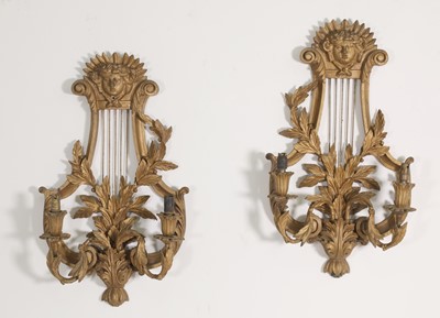 Lot 14 - A pair of carved wooden wall lights