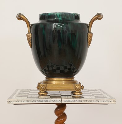 Lot 90 - A green flambé-glazed faience urn