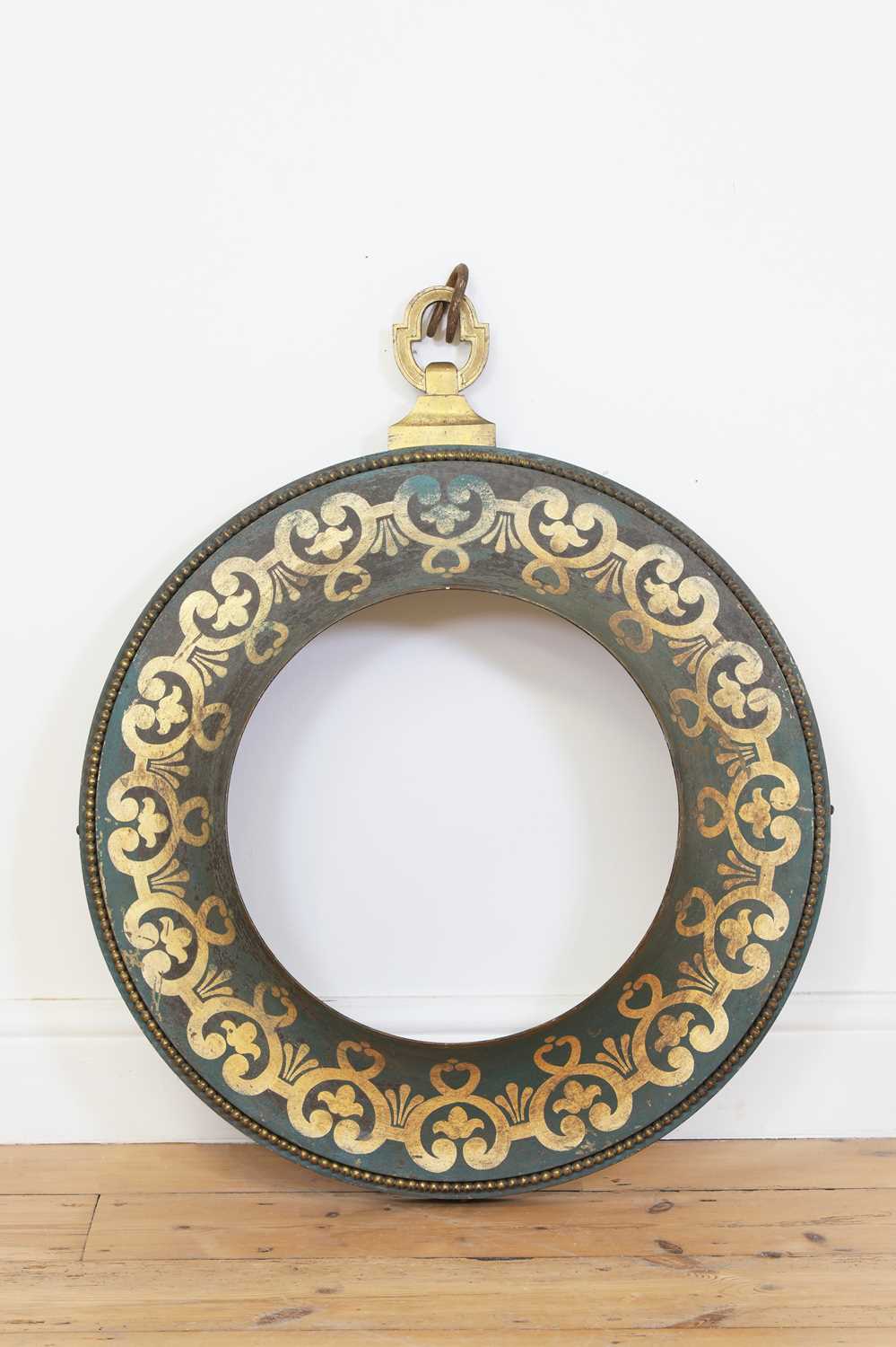 Lot 219 - A French 'tole peinte' circular frame