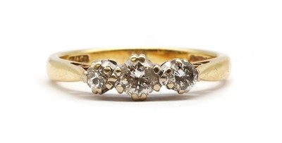 Lot 73 - An 18ct gold three stone diamond ring