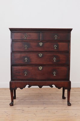 Lot 579 - A George II oak chest on stand