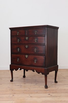 Lot 579 - A George II oak chest on stand