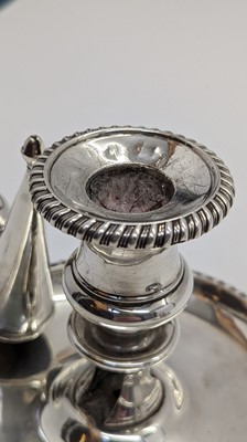 Lot 15 - A pair of George III silver chambersticks