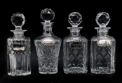 Lot 135 - A group of four crystal glass decanters
