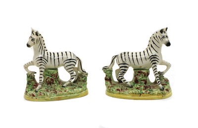 Lot 122 - A pair of Staffordshire pottery zebras