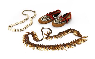 Lot 237 - A pair of leather and beadwork moccasins