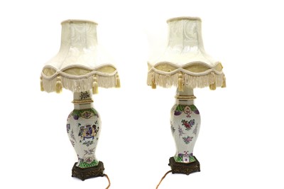 Lot 107 - A pair of porcelain lamps by Samson