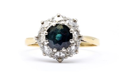Lot 202 - A gold sapphire and diamond cluster ring