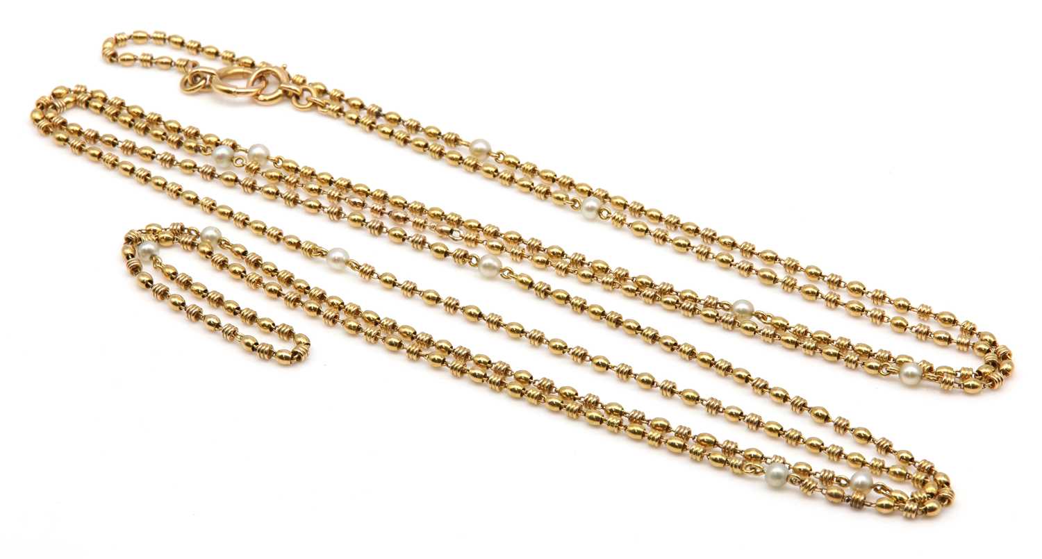 Lot 121 - A French pearl set long chain