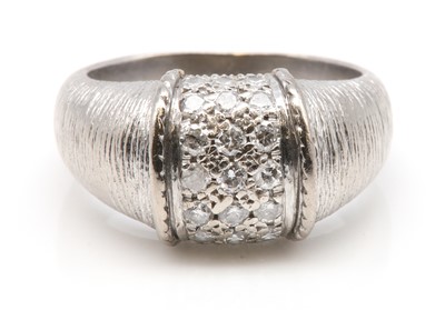 Lot 450 - A diamond set bombé ring, by Piaget