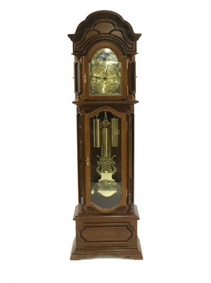 Lot 434 - An oak longcase clock