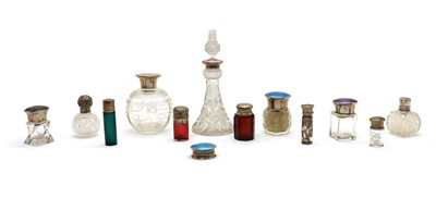 Lot 20 - A collection of coloured and clear glass dressing table and scent bottles