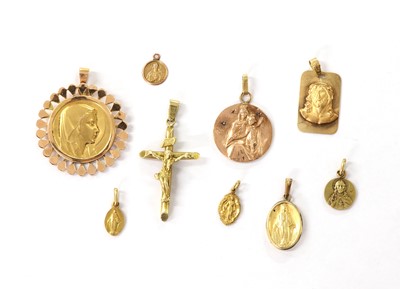 Lot 253 - A collection of gold religious and baptismal pendants