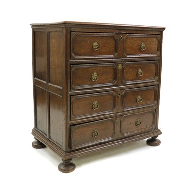 Lot 439 - A Charles II oak geometric moulded chest of drawers