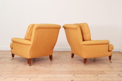 Lot 594 - A pair of club armchairs in the manner of Howard & Sons
