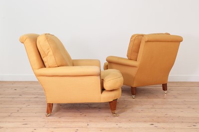 Lot 594 - A pair of club armchairs in the manner of Howard & Sons