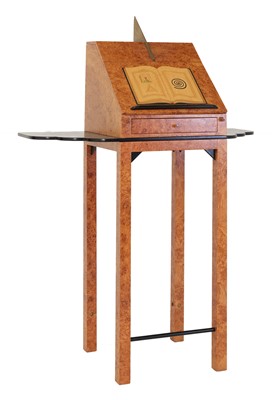 Lot 583 - A contemporary burr maple and ebonised reading stand