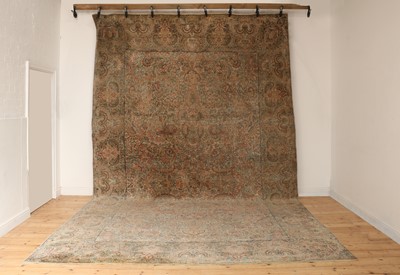 Lot 581 - A large Persian wool carpet