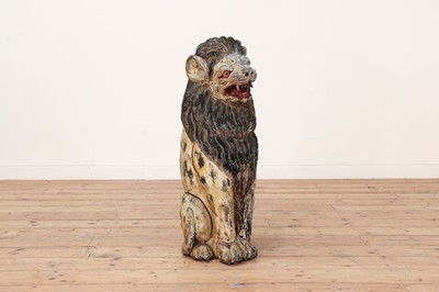 Lot 50 - A large carved and painted wooden lion