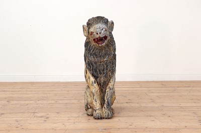 Lot 50 - A large carved and painted wooden lion