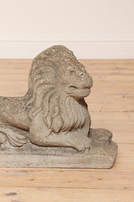 Lot 52 - A pair of reconstituted stone recumbent lions