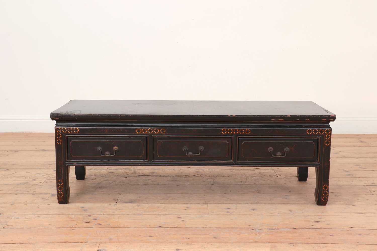 Lot 75 - A Chinese lacquered low table