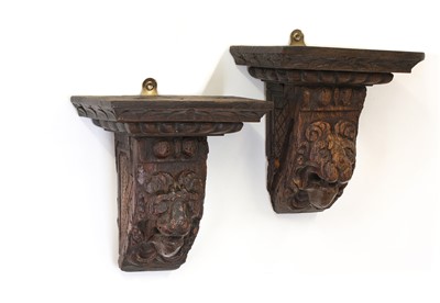Lot 53 - A pair of early lion mask carved oak corbels